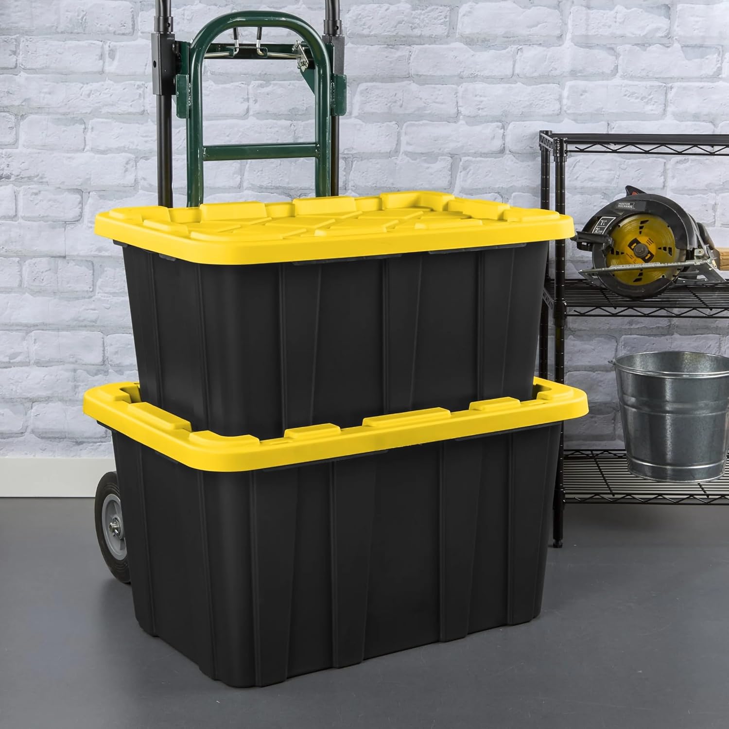 Stacked moving totes with hand truck ready for delivery